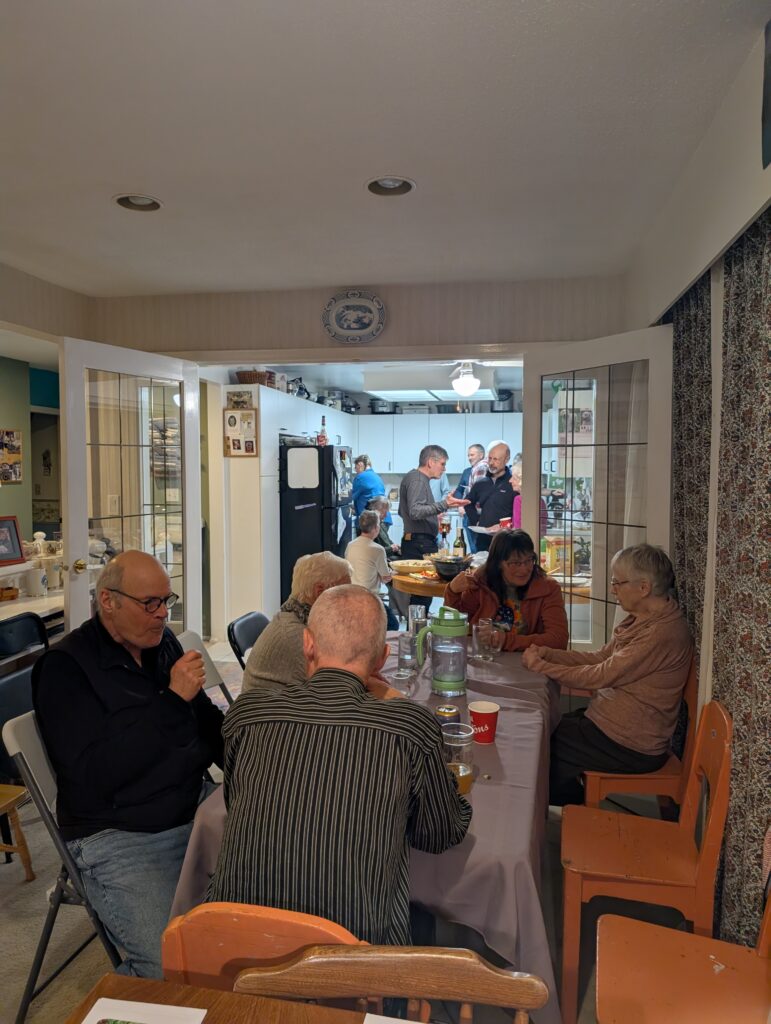 A friendly crowd sitting around the table