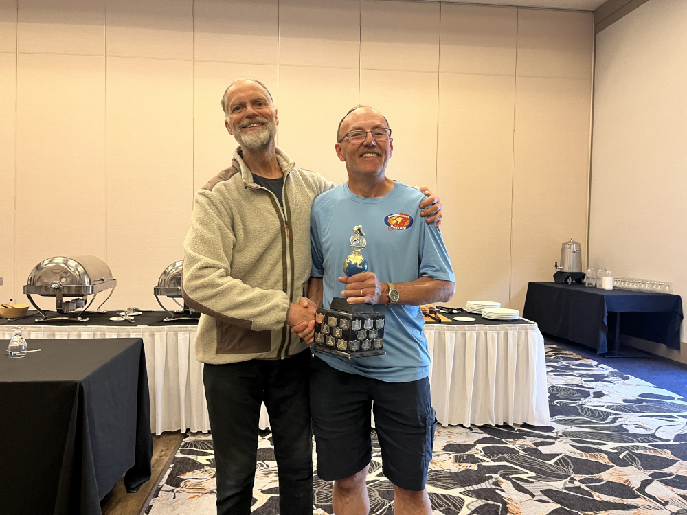 Bob Goodison receiving the John Hathaway Iron Butt Trophy from President Mike Hagen.