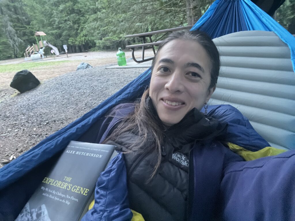 Dara in a hammock with a book