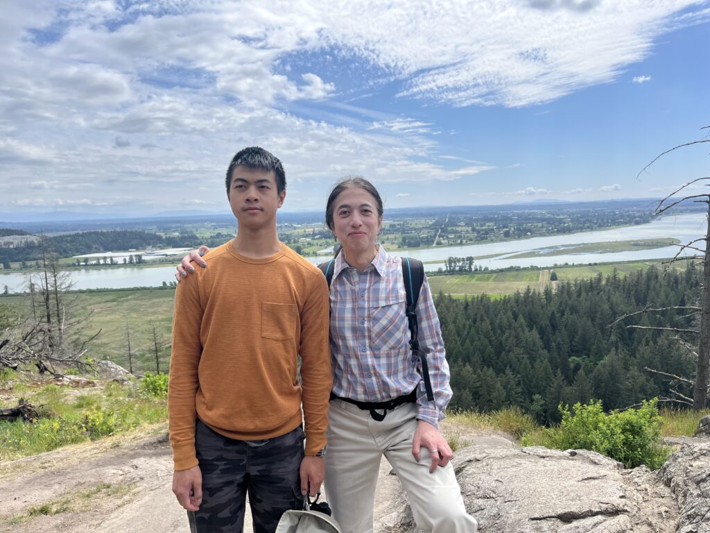 Fabian and Dara at High Knoll Lookout (Minnekhada Regional Park), with Pitt River in the background