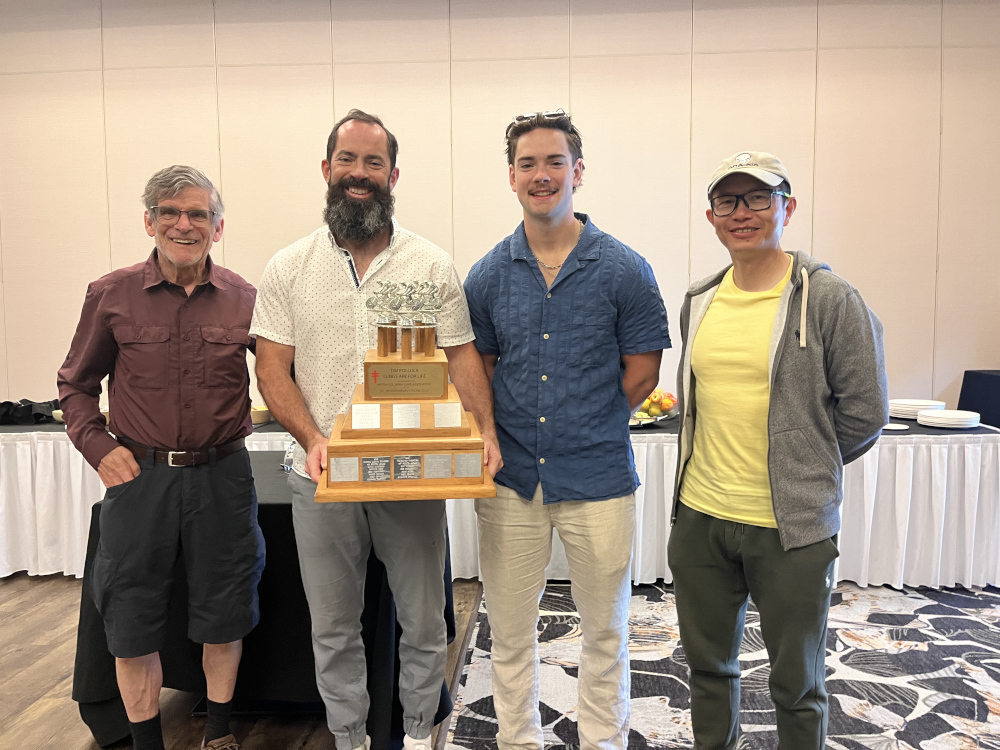 Three Bs and friends receiving the Tim Pollock trophy.