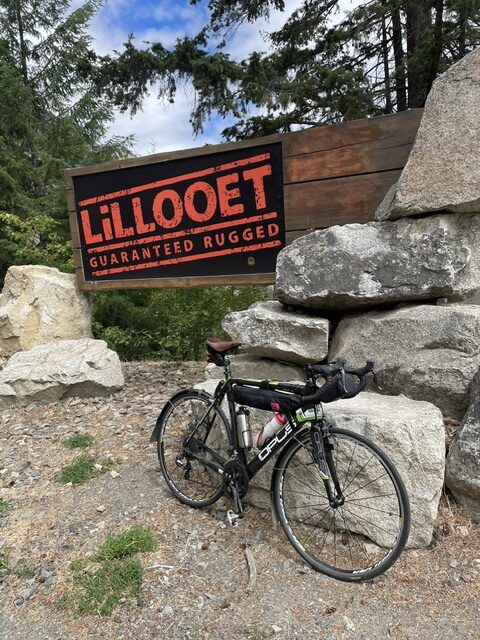a bike leaning against the Lillooet sign. 10Jun2026