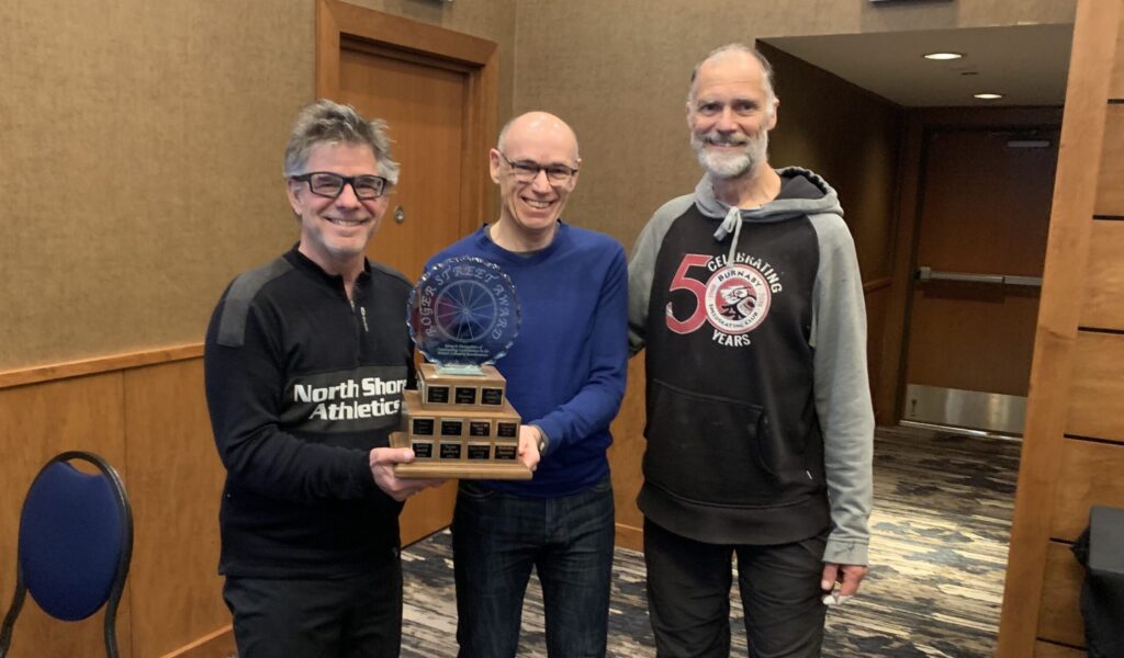 Dug Andusiek and Murray Tough receiving the Roger Street Award, along with presenter Mike Hagen. 